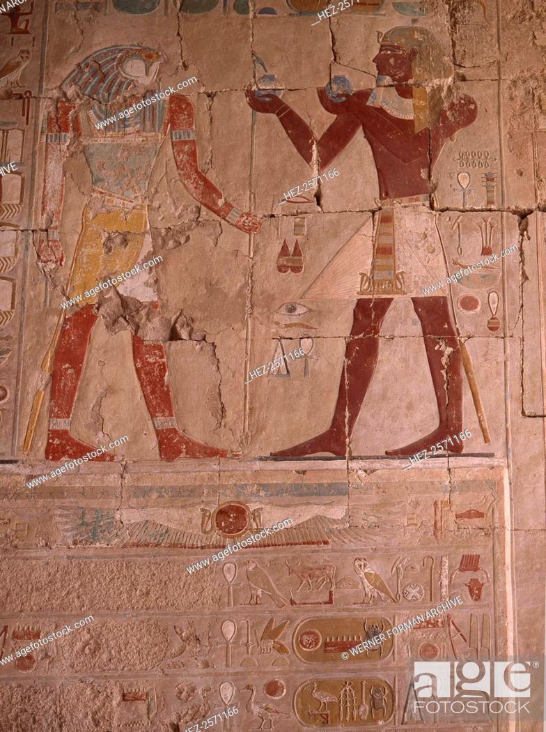 Stock Photo: A wall painting in the Chapel of Anubis at the temple of Hatshepsut. Hatshepsut depictured as a male pharaoh brings offerings to the god Horus.