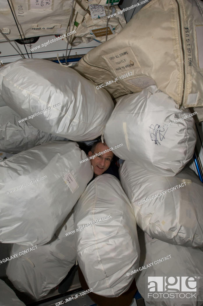 Stock Photo: NASA astronaut Don Pettit, Expedition 30 flight engineer, is pictured among stowage bags in the Harmony node of the International Space Station.