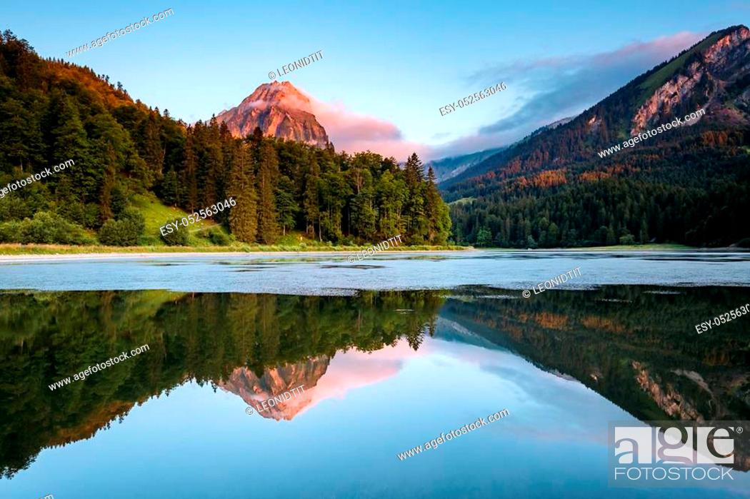 Stock Photo: Great view of the azure pond Obersee glowing by sunlight. Popular tourist attraction. Picturesque and gorgeous scene. Location famous place Nafels, Mt.