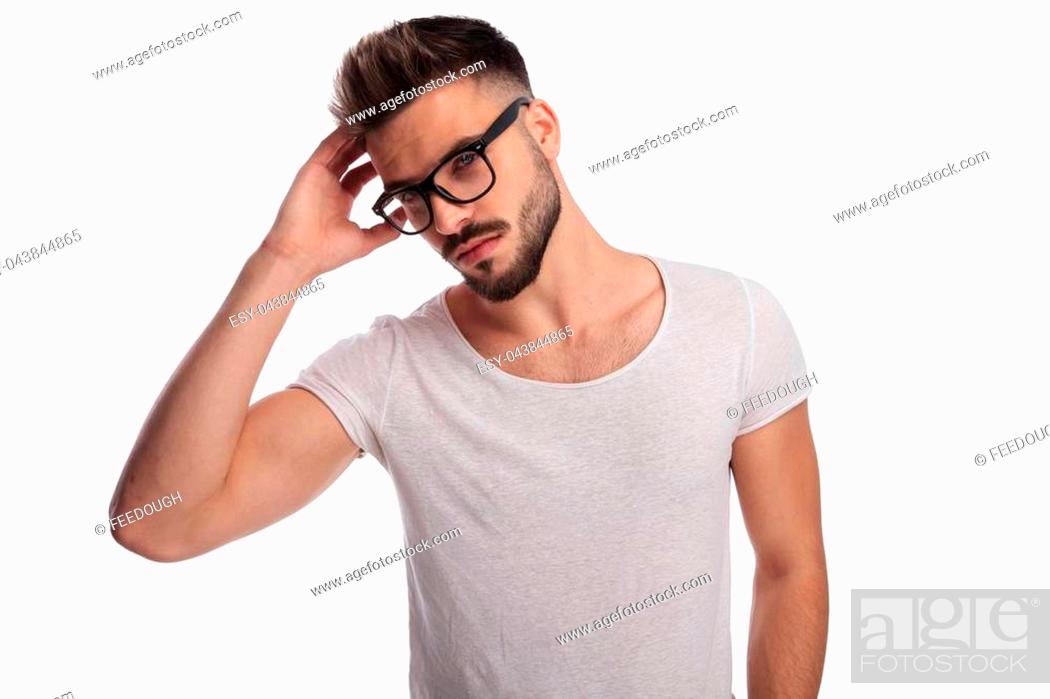sexy casual man fixing his hair style on white background, Stock Photo,  Picture And Low Budget Royalty Free Image. Pic. ESY-043844865 | agefotostock