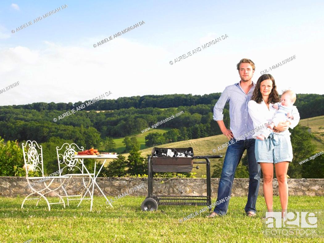Stock Photo: young family in front of view.