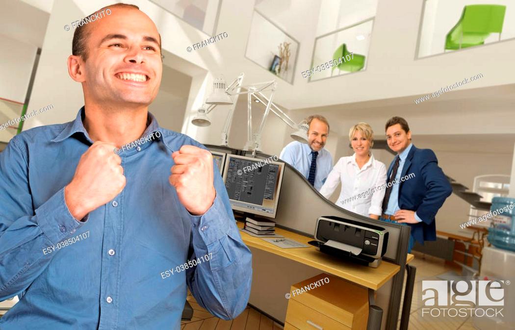 Stock Photo: Celebrating man in a modern busy office.