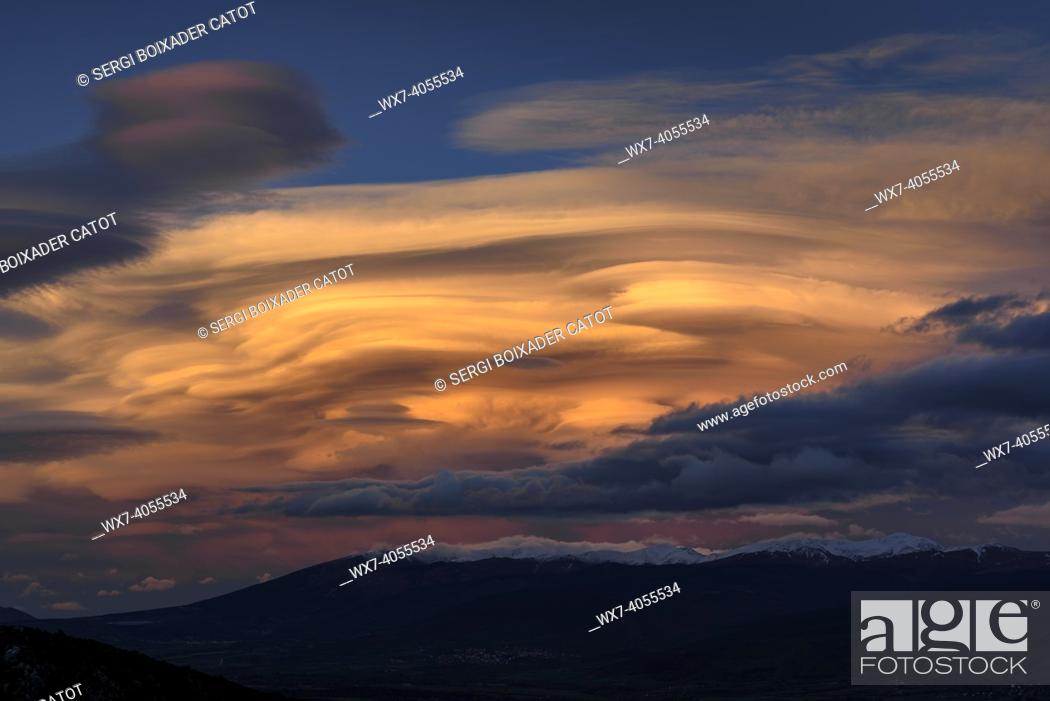Stock Photo: Spring sunset in La Cerdanya, seen from near Ordèn, with lenticular clouds over Puigmal - Cambredase (Lleida, Catalonia, Spain, Pyrenees).