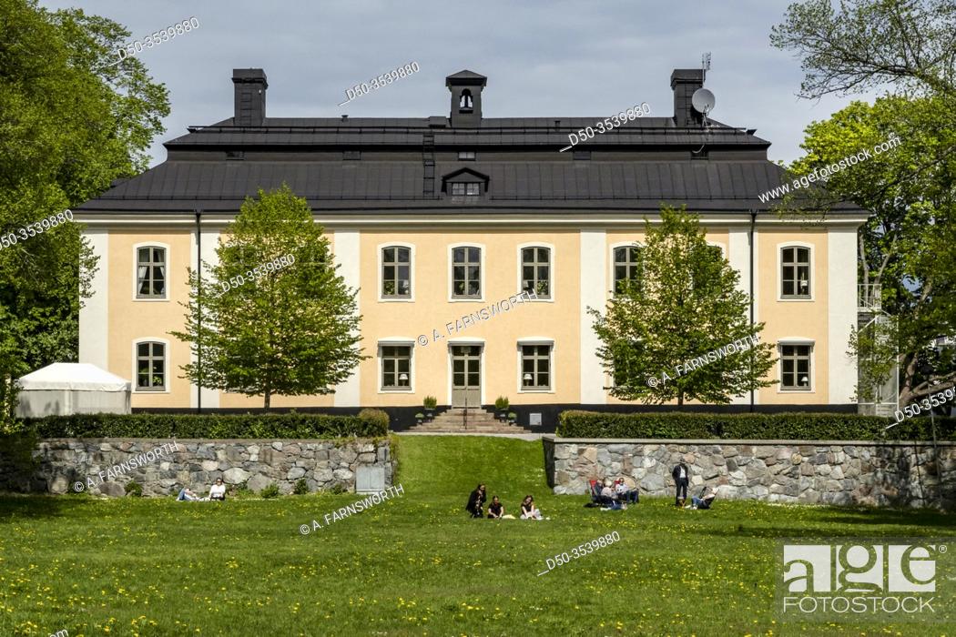 Stock Photo: Stockholm, Sweden People sitting on the grass at the Akeshovs castle in the Bromma suburb.