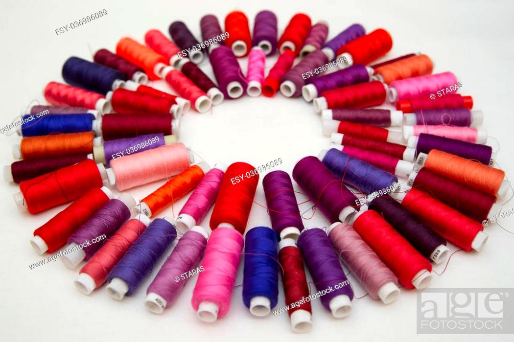 Stock Photo: Background of colorful spools of thread. Top view.