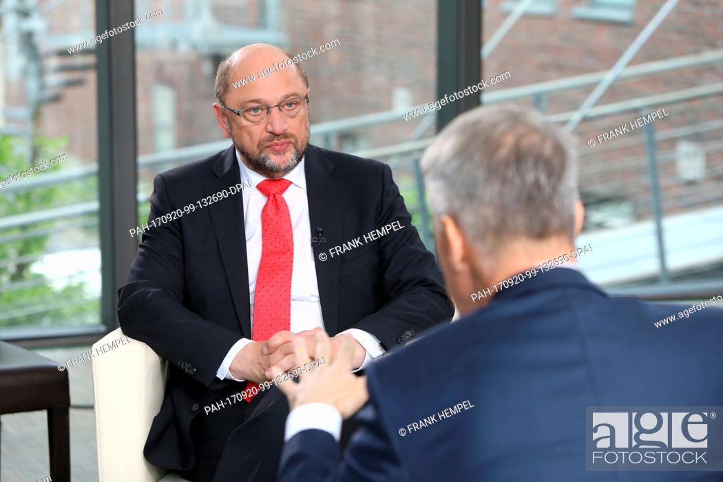 Stock Photo: HANDOUT - The handout picture made available shows Germany's Social Democratic Party's (SPD) top candidate Martin Schulz (L) being interviewed by RTL head.