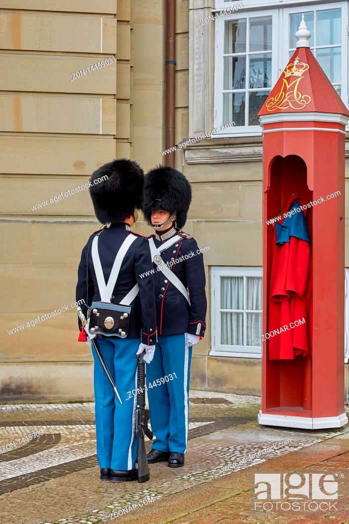 Stock Photo: COPENHAGEN, DENMARK - SEPTEMBER 16, 2017: Royal Guards during the ceremony of changing the guards on the square at Amalienborg Castle, Copenhagen, Denmark.