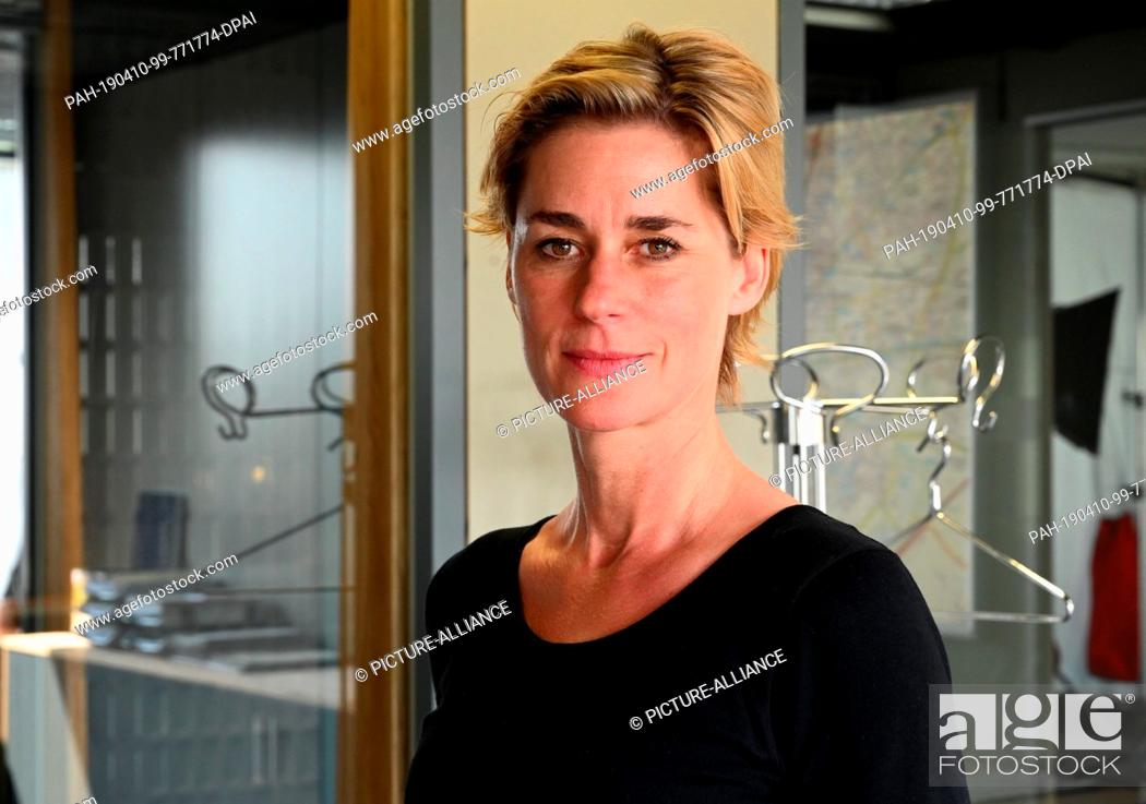 Stock Photo: 10 April 2019, North Rhine-Westphalia, Köln: The director Nina Wolfrum stands in the new commissariat during the shooting of the new Cologne ""Tatort - Niemals.