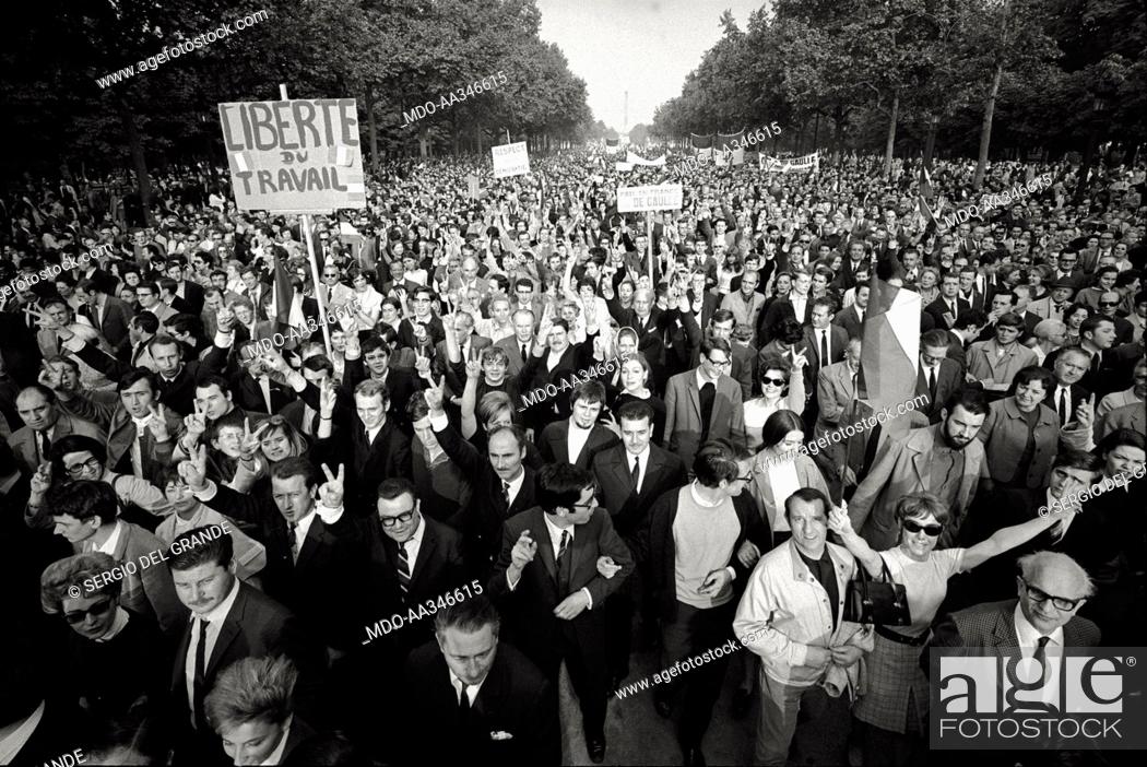 Stock Photo: The risk of a revolution in Paris has been averted. Placards exalting 'work freedom', the end of strikes, and the support to President De Gaulle in a.