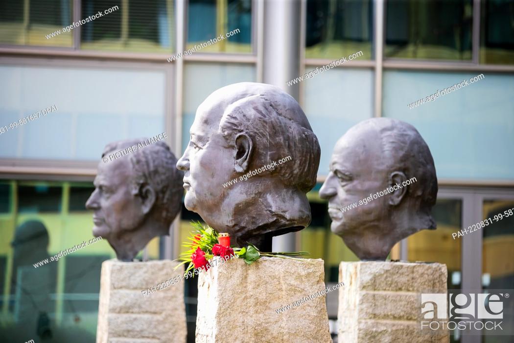 Stock Photo: 31 August 2022, Russia, Moskau: Flowers lie at the monument ""Fathers of Unity"" by French sculptor Serge Mangin at the head of the last president of the Soviet.