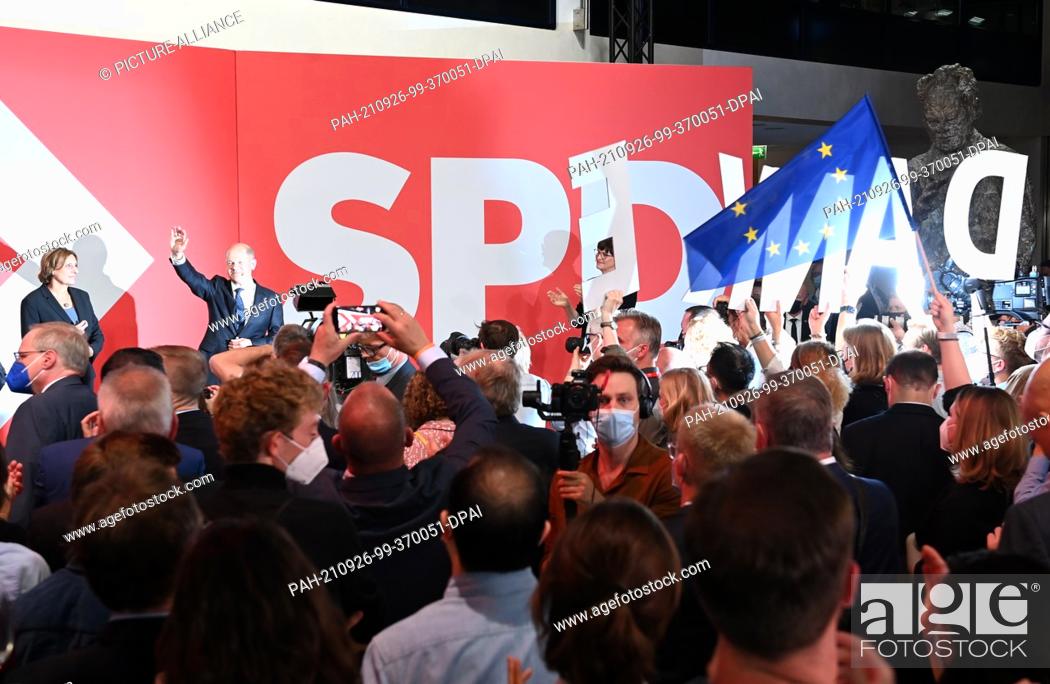 Stock Photo: 26 September 2021, Berlin: Olaf Scholz, Finance Minister and SPD candidate for Chancellor, waves next to his wife Britta Ernst during the election party at.
