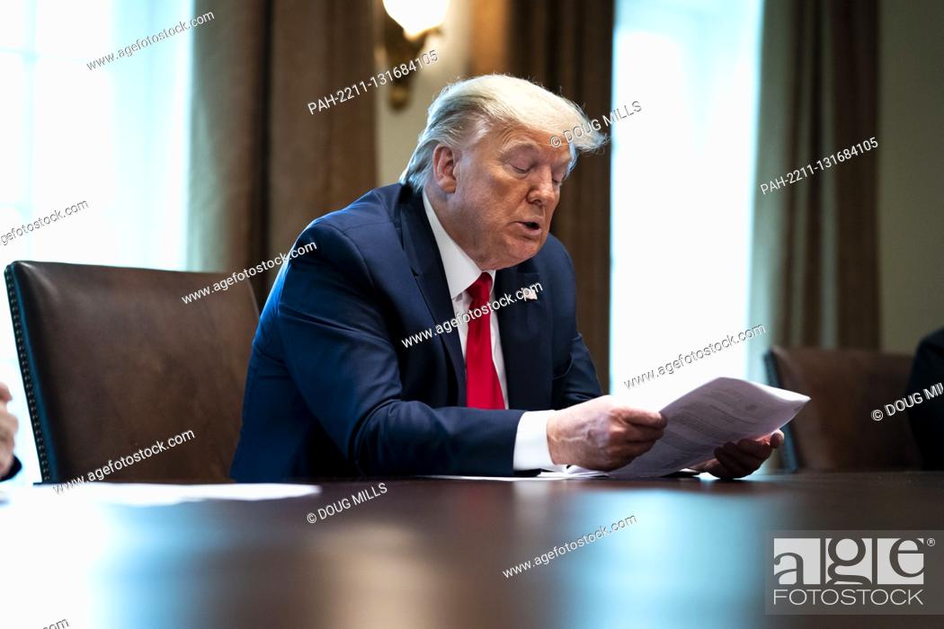 Stock Photo: United States President Donald J. Trump makes remarks as he meets with recovered COVID-19 patients in the Cabinet Room, Tuesday April 14, 2020.