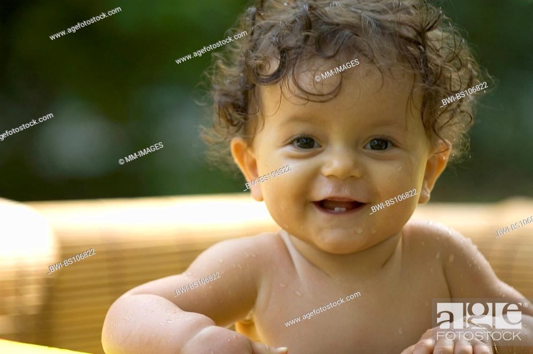 sweet baby with dark curly hair in pool, Stock Photo, Picture And Rights  Managed Image. Pic. BWI-BS106822 | agefotostock