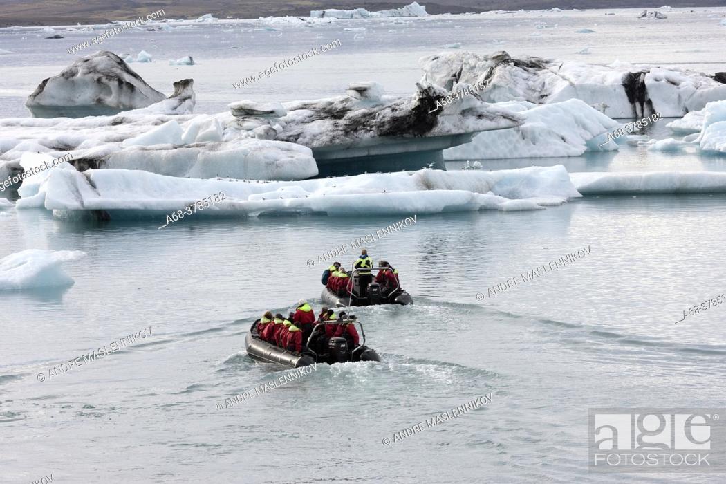 Stock Photo: Boat trip on Jökulsarlon which is a calving bay from Vatnjökull. It has retreated by several kilometers due to climate change and the warmer weather.