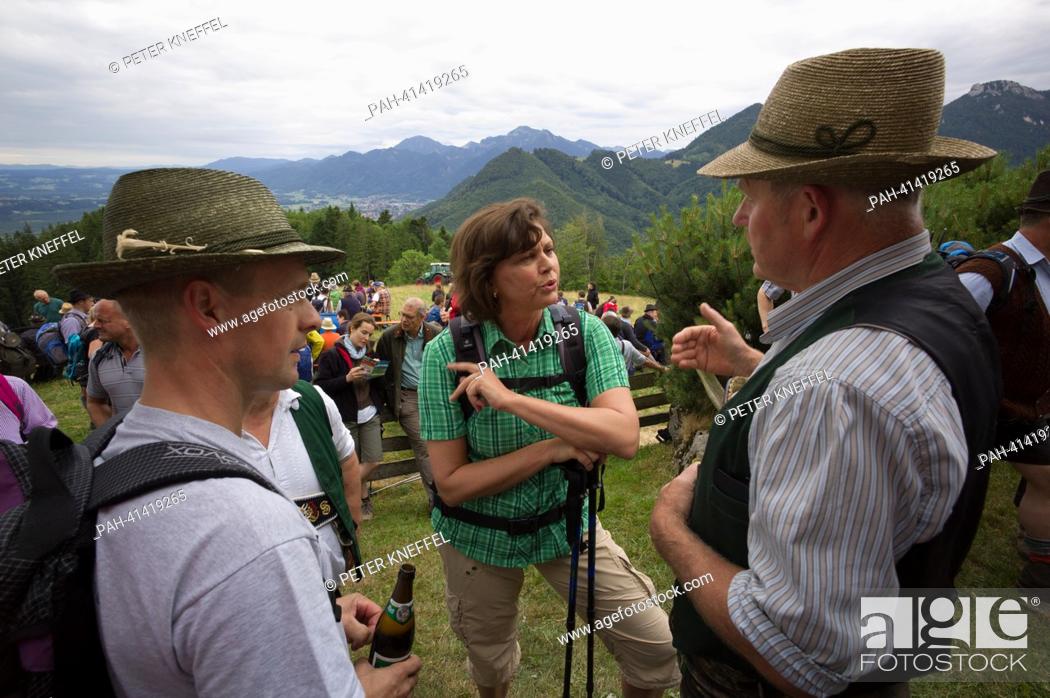 Stock Photo: German agriculture minister Ilse Aigner (C, CSU) talks to alp farmers during the main alp inspection on the Hefter alp near Grassau, Germany, 31 July 2013.