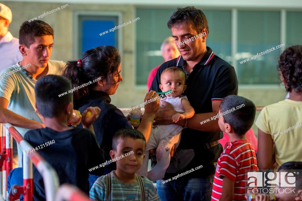 Stock Photo: The asylum seeking family Nazar with mother Shema (middle) and father Yulmhamed Fasni (R), and uncle (from left to right) and children Based, Taher.