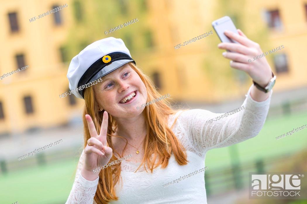 Stock Photo: Teenage girl wearing graduation cap.