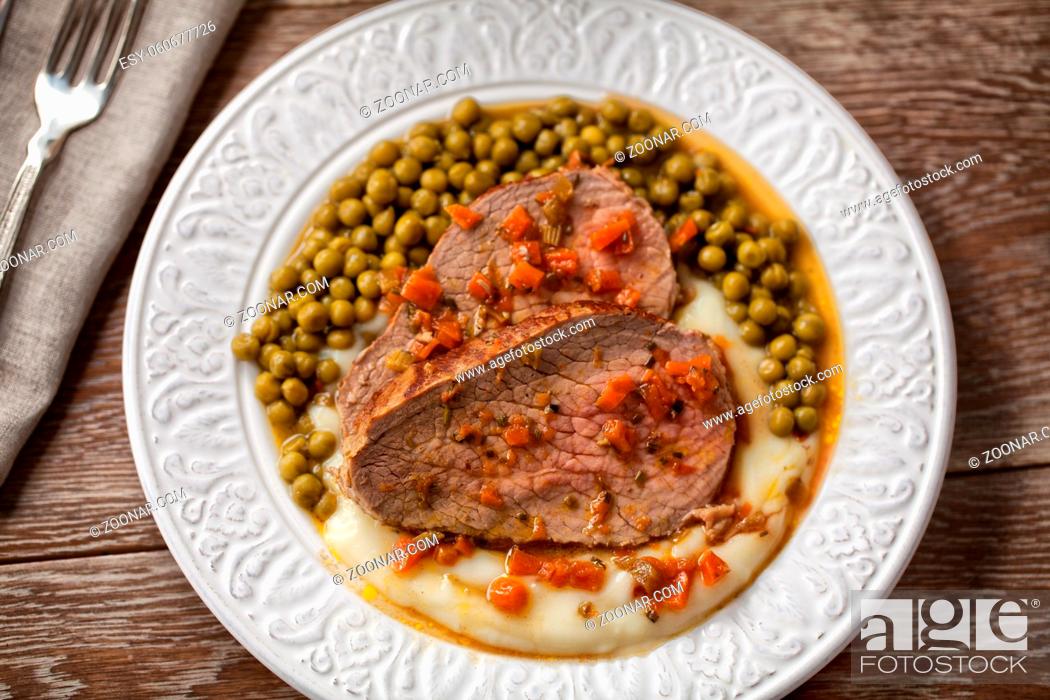 Stock Photo: Roast Beef With Mashed Potatoes and Peas.