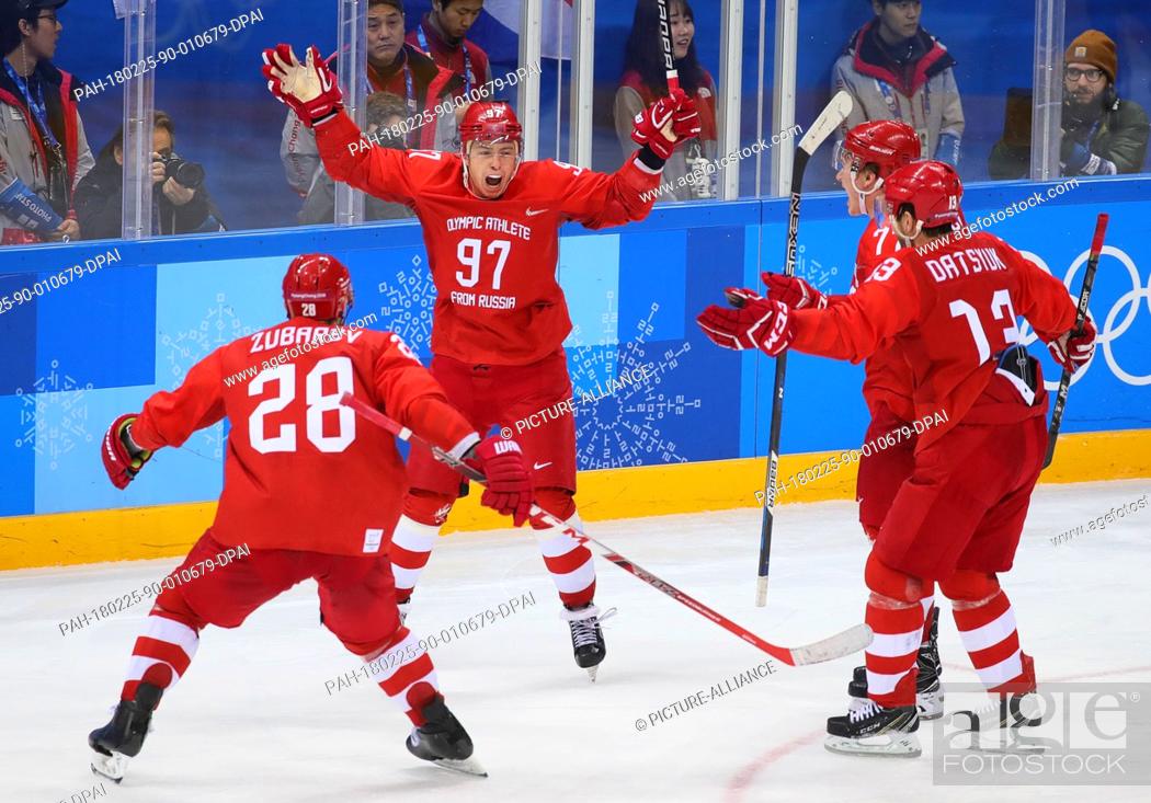 Stock Photo: 25 February 2018, South Korea, Gangneung - Olympics, Ice Hockey, Men's Final, OAR vs. Germany, Gangneung Hockey Centre: Nikita Gussev (97), Andrej Subarev.