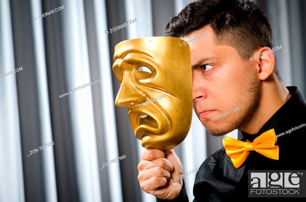 Stock Photo: Funny concept with theatrical mask.