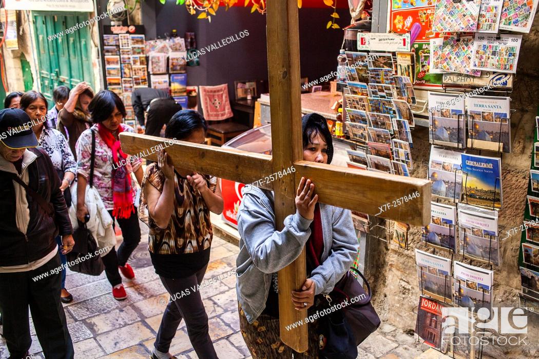 Stock Photo: Pilgrims following Jesus' steps on Way of the cross, Via Dolorosa street, Old City, Jerusalem, Israel.
