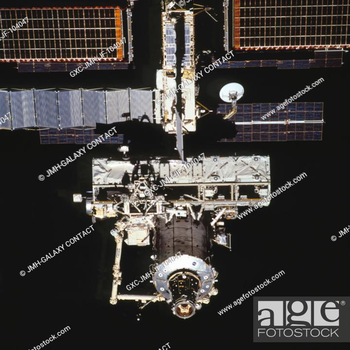 Stock Photo: Backdropped by the blackness of space, this close-up view of the International Space Station (ISS) was photographed by a crewmember on board the Space Shuttle.