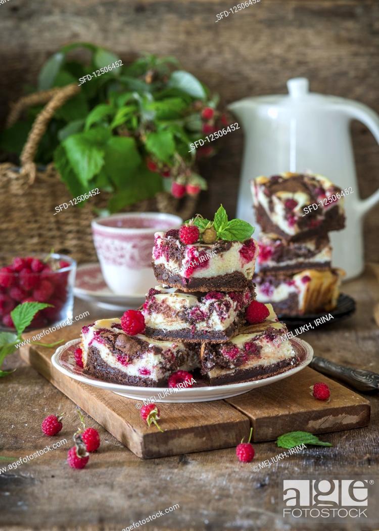Stock Photo: Cheesecake brownie with raspberries.