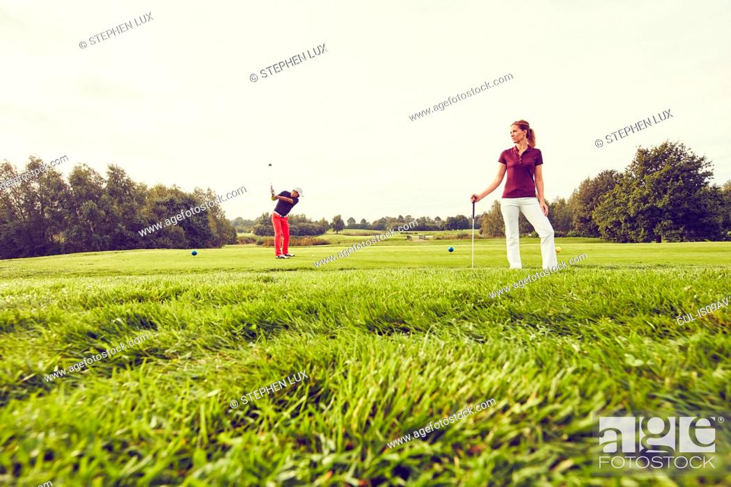 Stock Photo: Golfers playing golf on course, Korschenbroich, Dusseldorf, Germany.