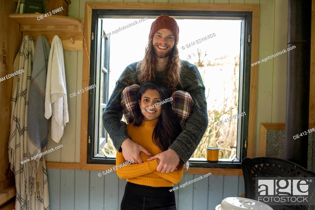 Stock Photo: Portrait happy young couple in cabin window.