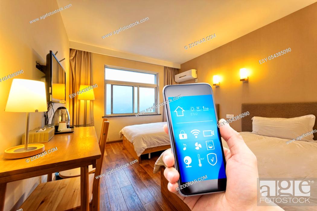Stock Photo: smart phone with smart home and modern bedroom.