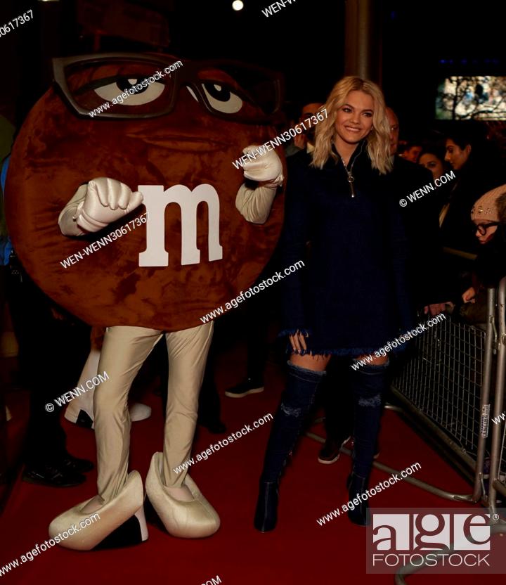 Stock Photo: Former X Factor winner Louisa Johnson performs live at M&M World followed by the unveiling of 150ft giant chocolate wall of M&M's.