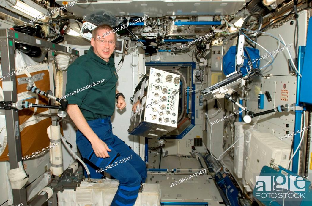 Stock Photo: European Space Agency astronaut Frank De Winne, Expedition 20 flight engineer and Expedition 21 commander, is pictured near Portable Pulmonary Function System.