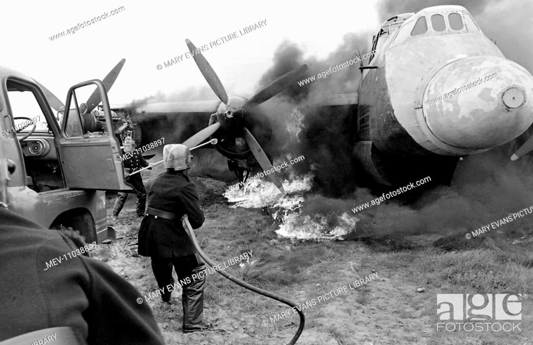 Stock Photo: Aircraft Firefighters’ School based at Stansted, Essex, where men and women from around the world were trained. Old aircraft were deliberately set ablaze to.