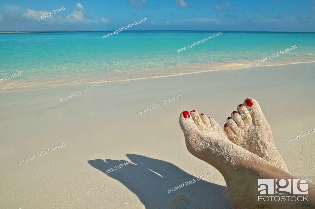 Stock Photo: Tourist relaxing on a Caribbean beach in Tobago Cays, St. Vincent and the Grenadines.