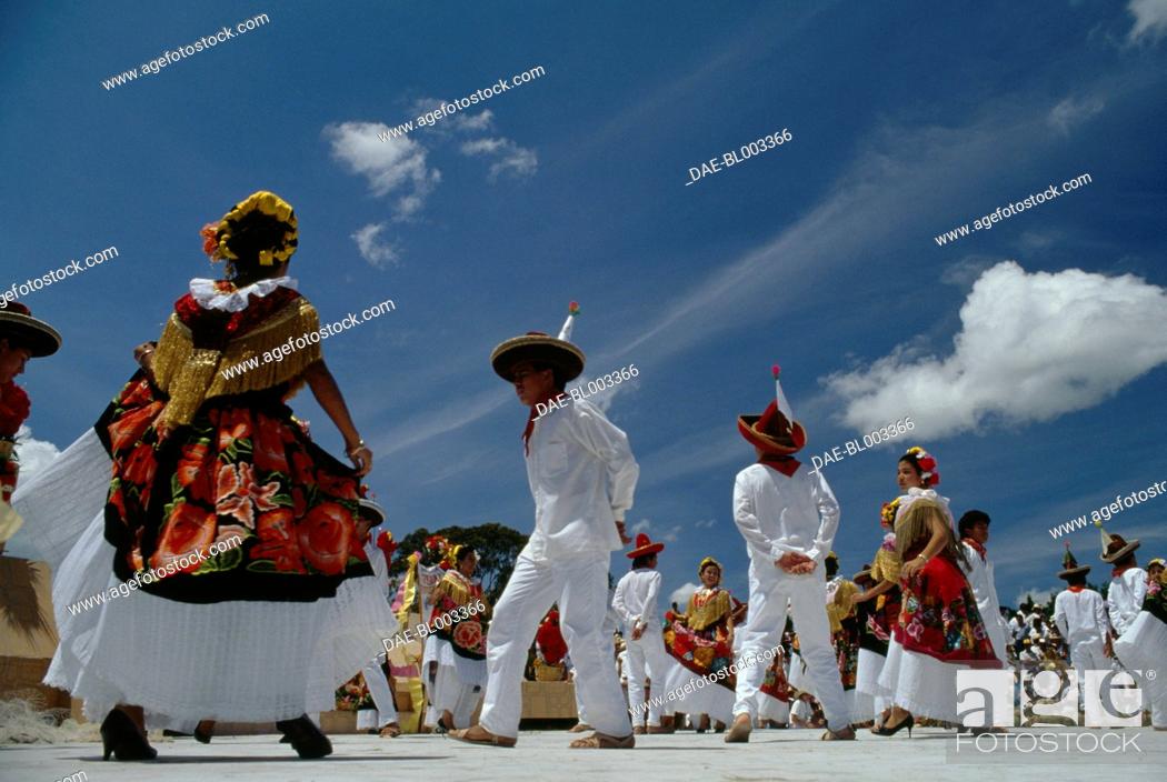 Stock Photo: Men and women in traditional costumes, Jarabe Mixteco dance during the celebrations at the Guelaguetza festival, Oaxaca, Mexico.