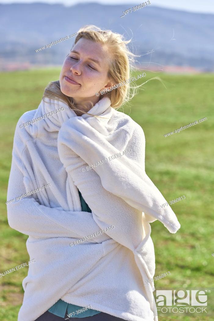 Stock Photo: Portrait of woman in nature wearing a white bathrobe. Waakirchen, Bavaria, Germany.