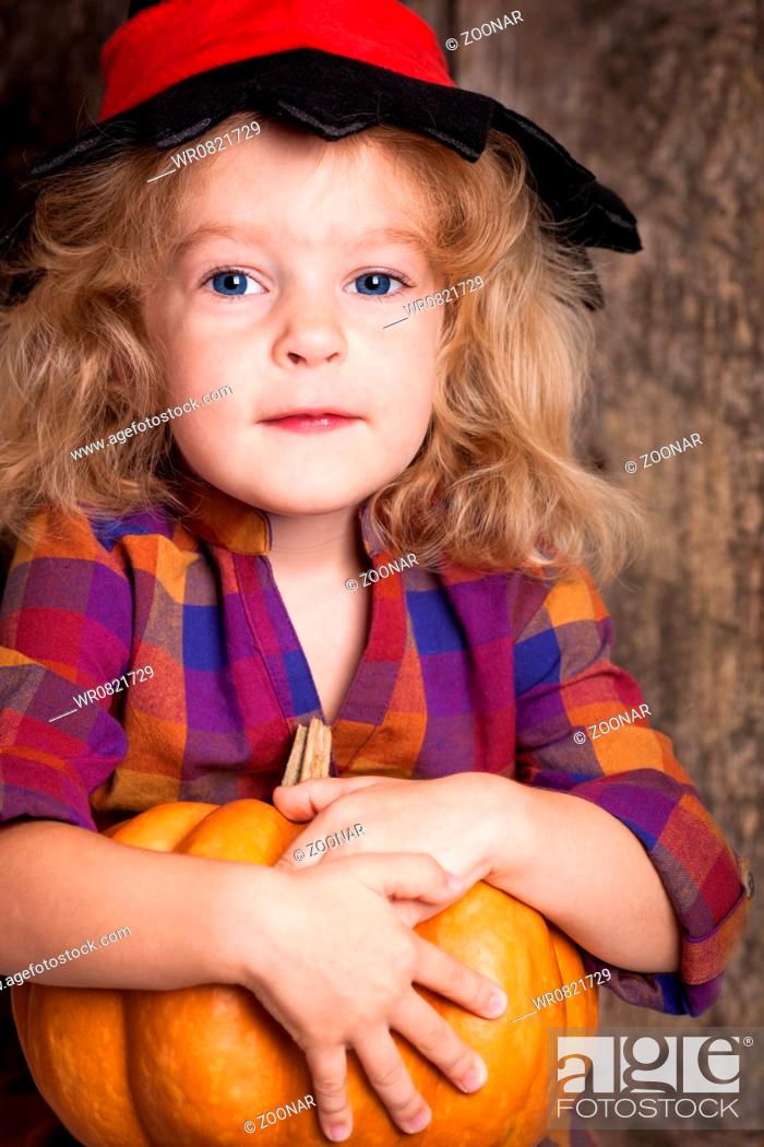 Stock Photo: Child with pumpkin.