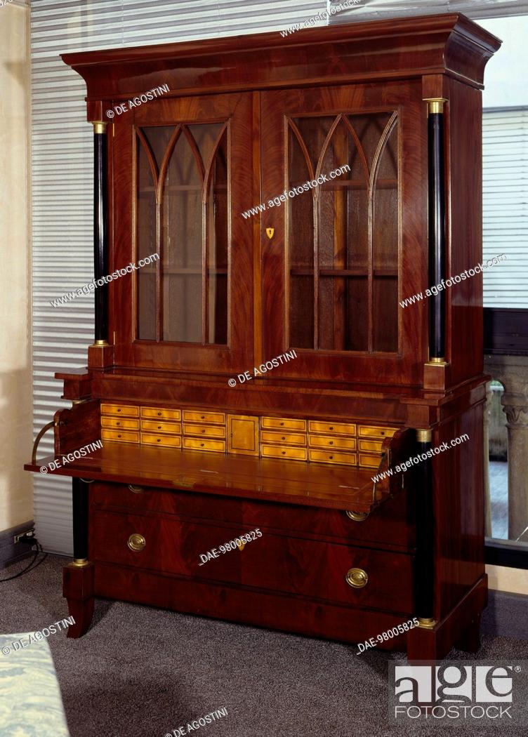 Stock Photo: Victorian mahogany breakfront secretary bookcase with central drop leaf and blond wood inlays, made in the Asian colonies, ca 1850, drop leaf open.