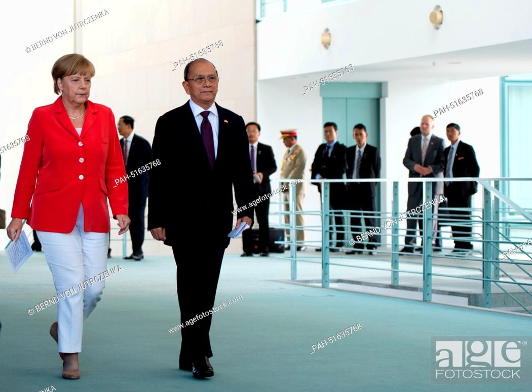Stock Photo: German Chancellor Angela Merkel (CDU, L) and the President of Myanmar, Thein Sein, arrive for a press conference in the Chancellery in Berlin, Germany.