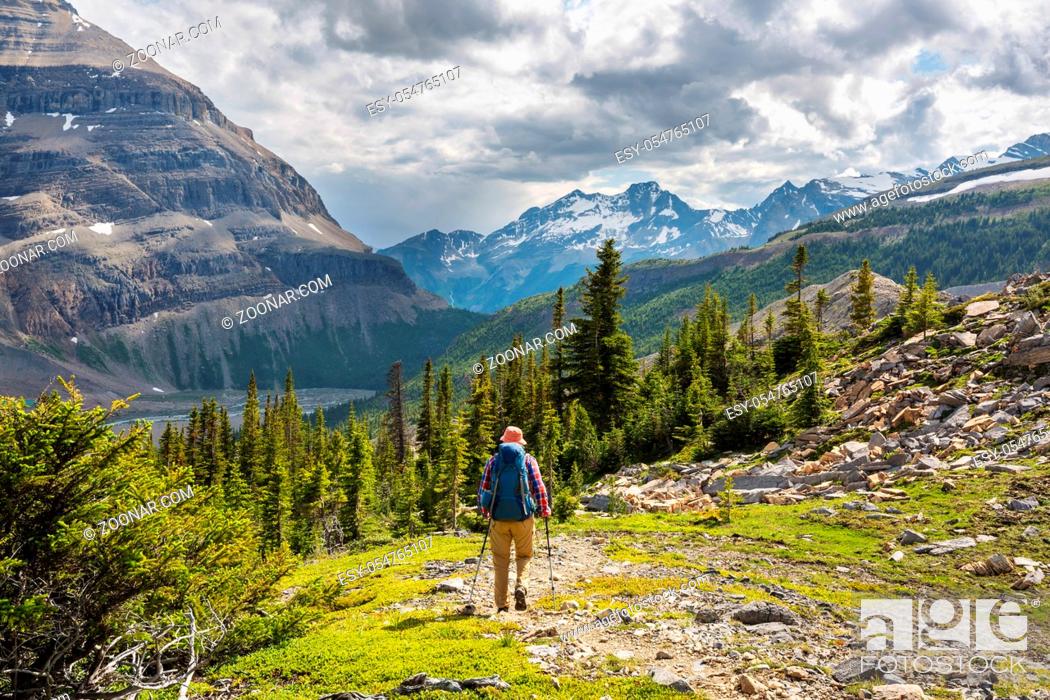 Stock Photo: Hiking man in Canadian mountains. Hike is the popular recreation activity in North America. There are a lot of picturesque trails.