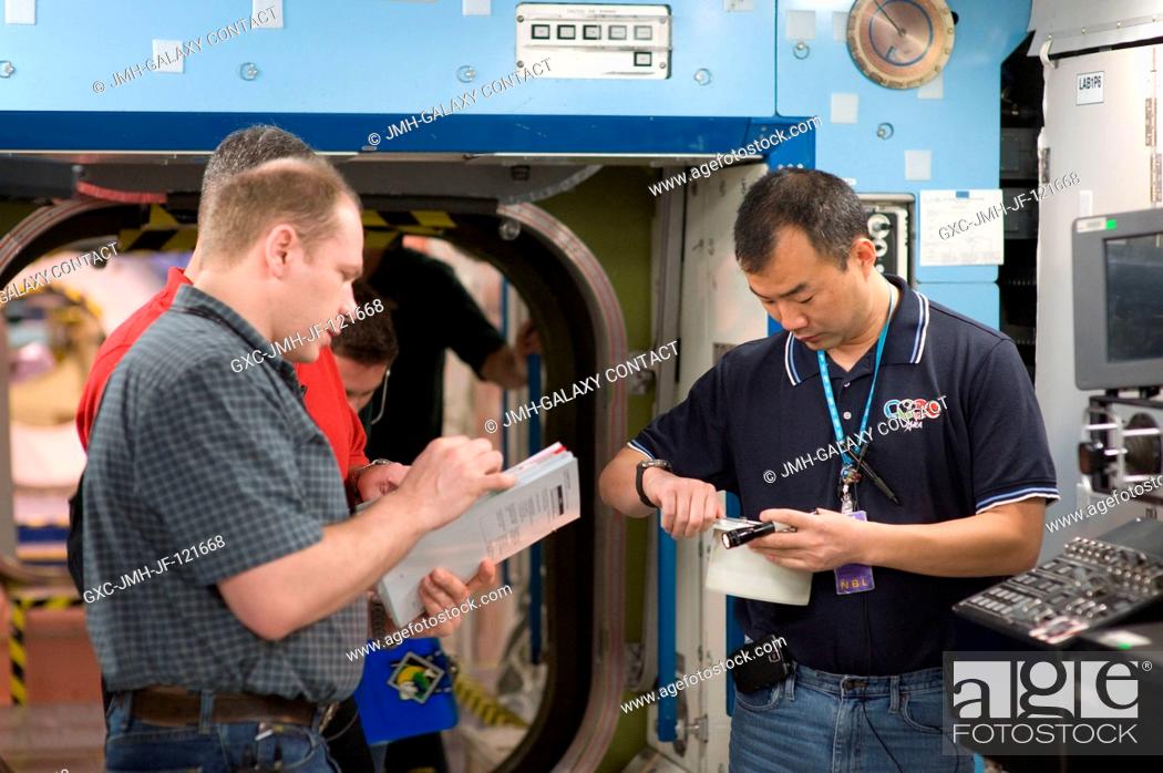Stock Photo: Cosmonaut Oleg Kotov (left), Expedition 22 flight engineer and Expedition 23 commander; along with Japan Aerospace Exploration Agency (JAXA) astronaut Soichi.