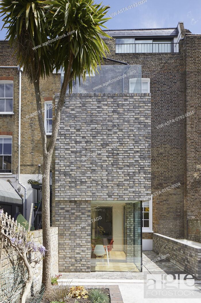 Stock Photo: Double-height rear extension with corner window on ground level. Queens House, London, United Kingdom. Architect: Paul Archer Design - Architects & Design, 2021.