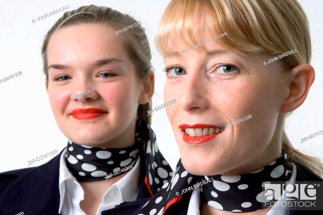 Stock Photo: Two women, dressed as air stewardesses, who offer a mobile retail service selling essential personal products in Nottingham nightclubs and social venues,.