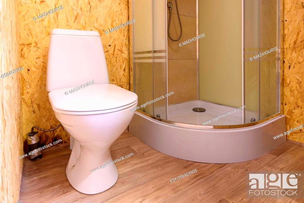 Stock Photo: Bathroom in a wooden house, toilet and shower.