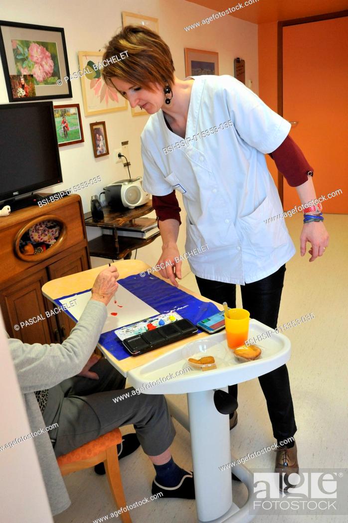 Stock Photo: Reportage on art therapy in Ham hospital?s Alzheimer's unit, France. Art therapy sessions are offered to residents in order to maintain or rehabilitate their.