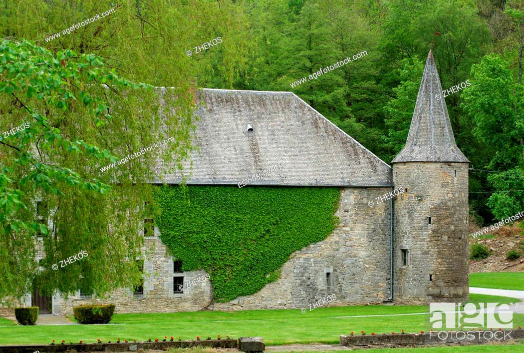 Stock Photo: Old Belgium Castle Château de Spontin on Green Forest background in Summer Day Outdoors.
