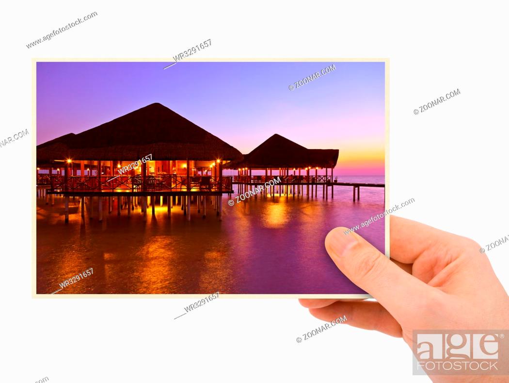 Stock Photo: Hand and Maldives beach image (my photo) isolated on white background.