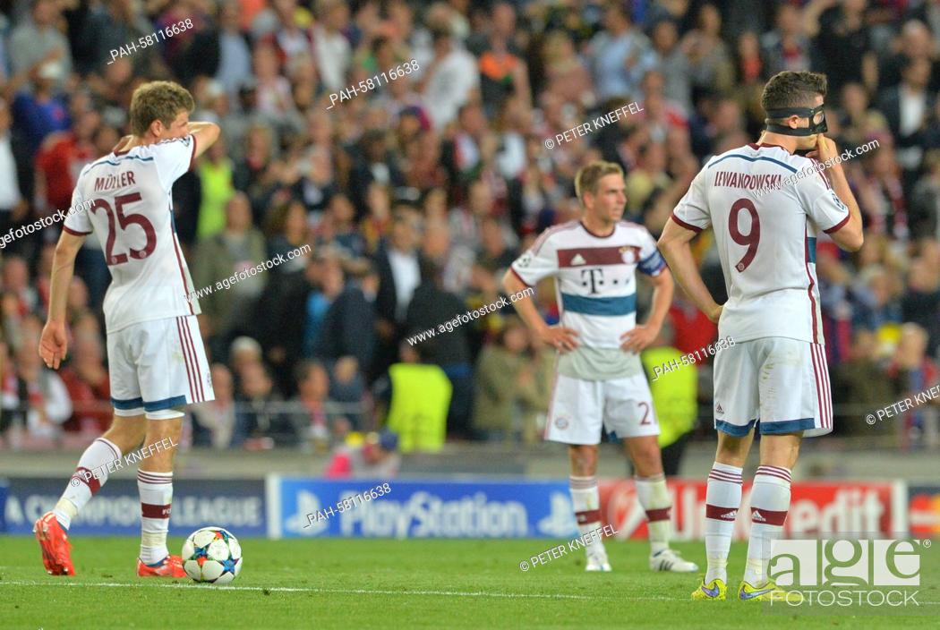 Stock Photo: Munich's Thomas Mueller (l-r), Philipp Lahm and Robert Lewandowski react during the UEFA Champions League semi-final first leg soccer match betweeen.