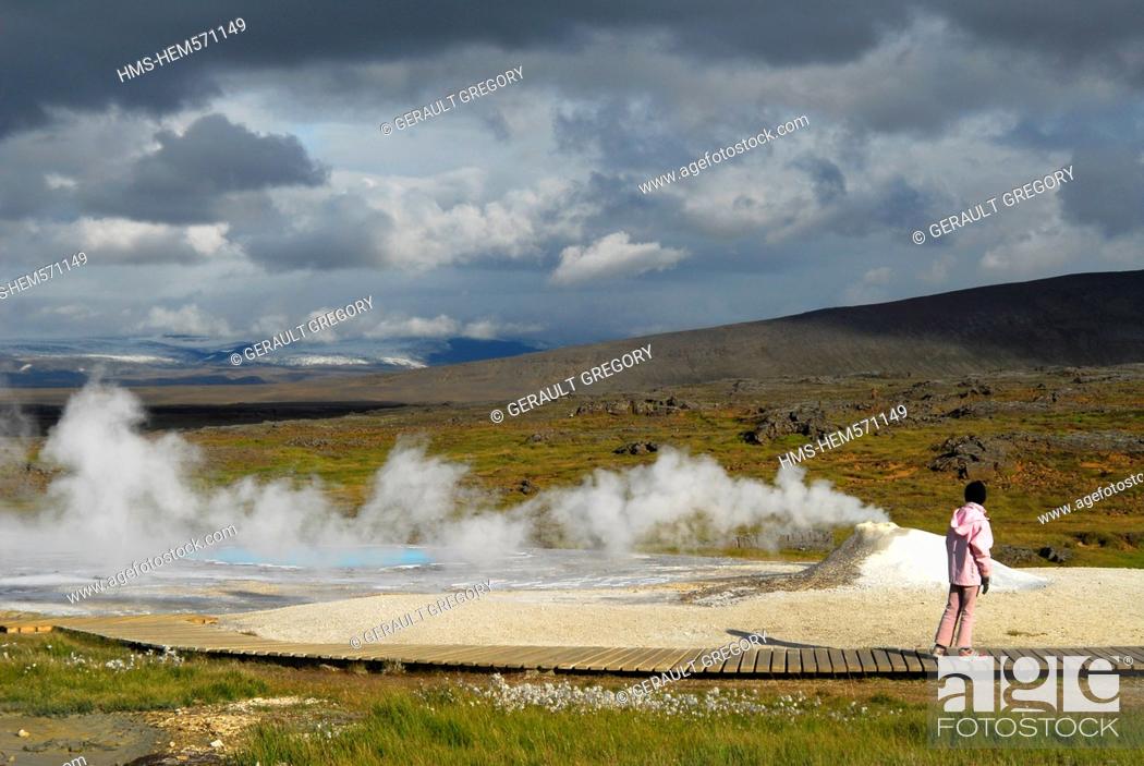 Stock Photo: Iceland, Nordurland Vestra Region, Hveravellir, fumarole on a concretion of geyserite and spring of warm water opaline, in the foreground woman from behind.
