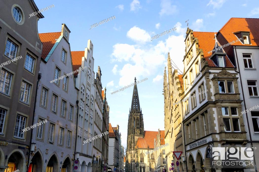 Stock Photo: Germany, North Rhine-Westphalia, Munster, Tower of Saint¶ÿLamberts Church between rows of residential buildings at Prinzipalmarkt square.